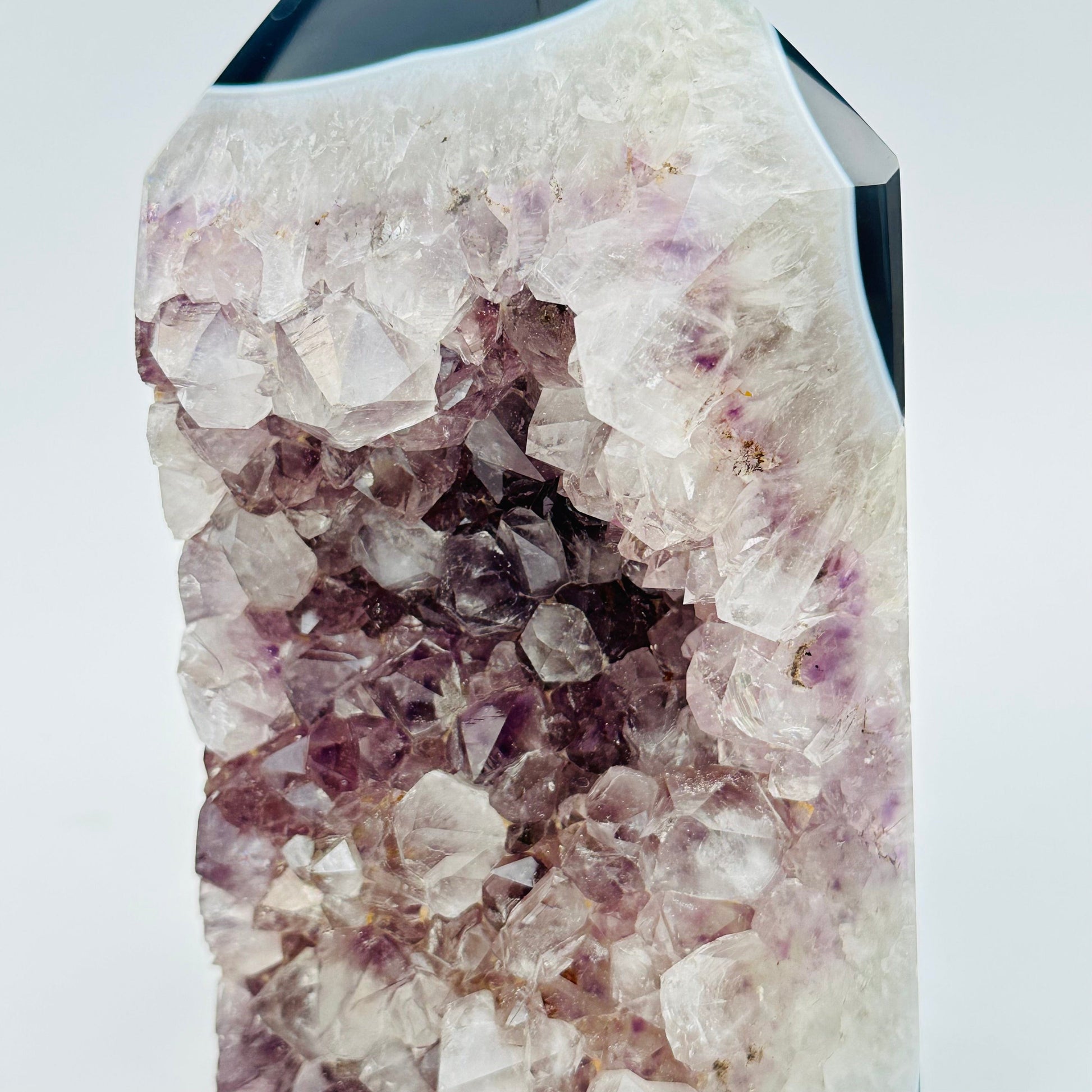 close up of the amethyst crystal clusters on this cut base 