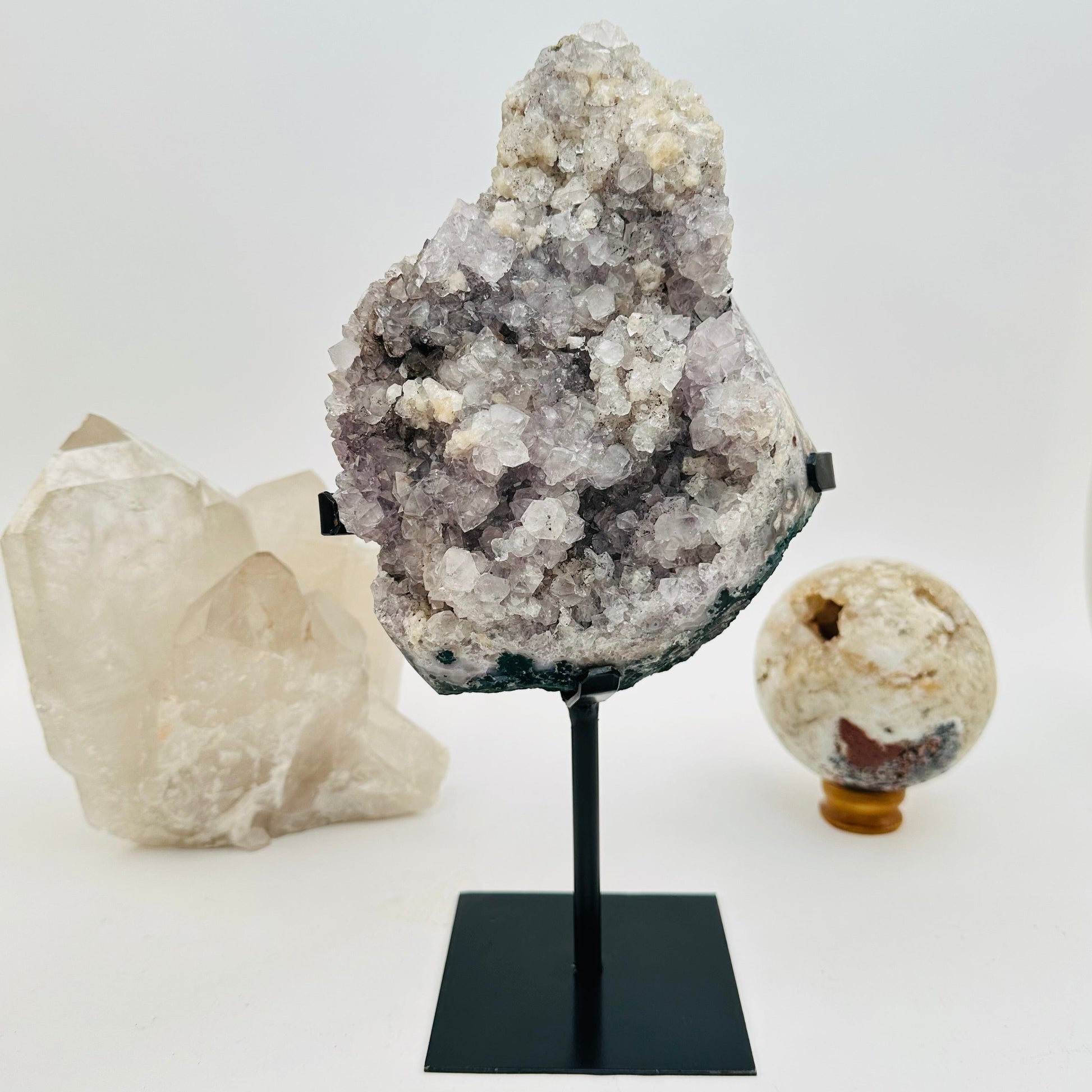 crystal cluster on metal stand displayed as home decor 