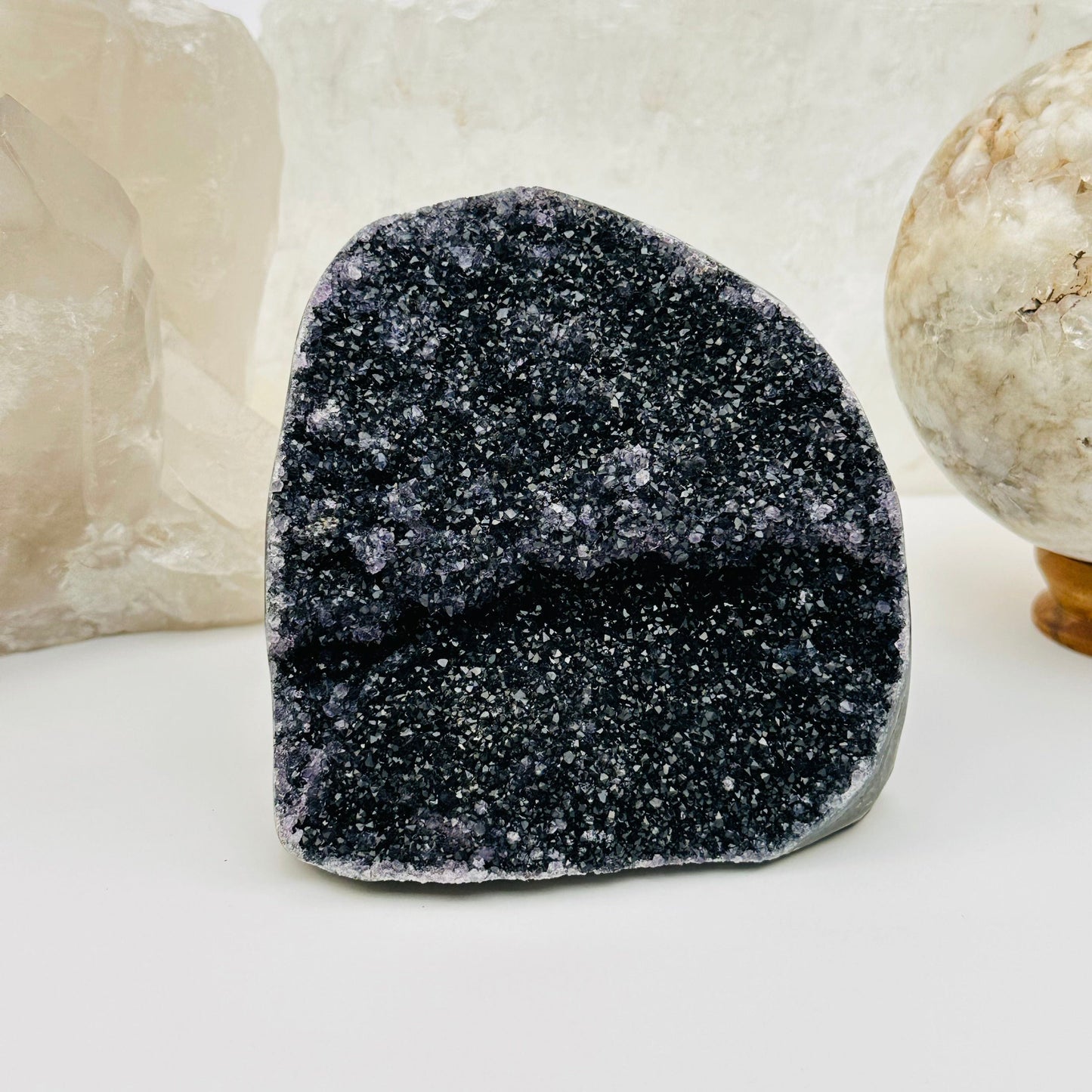 black amethyst druzy cut base crystals displayed as home decor 