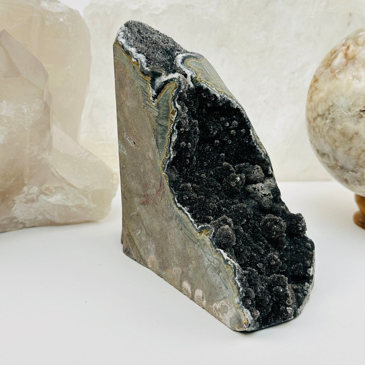 black amethyst druzy cut base crystals displayed as home decor 