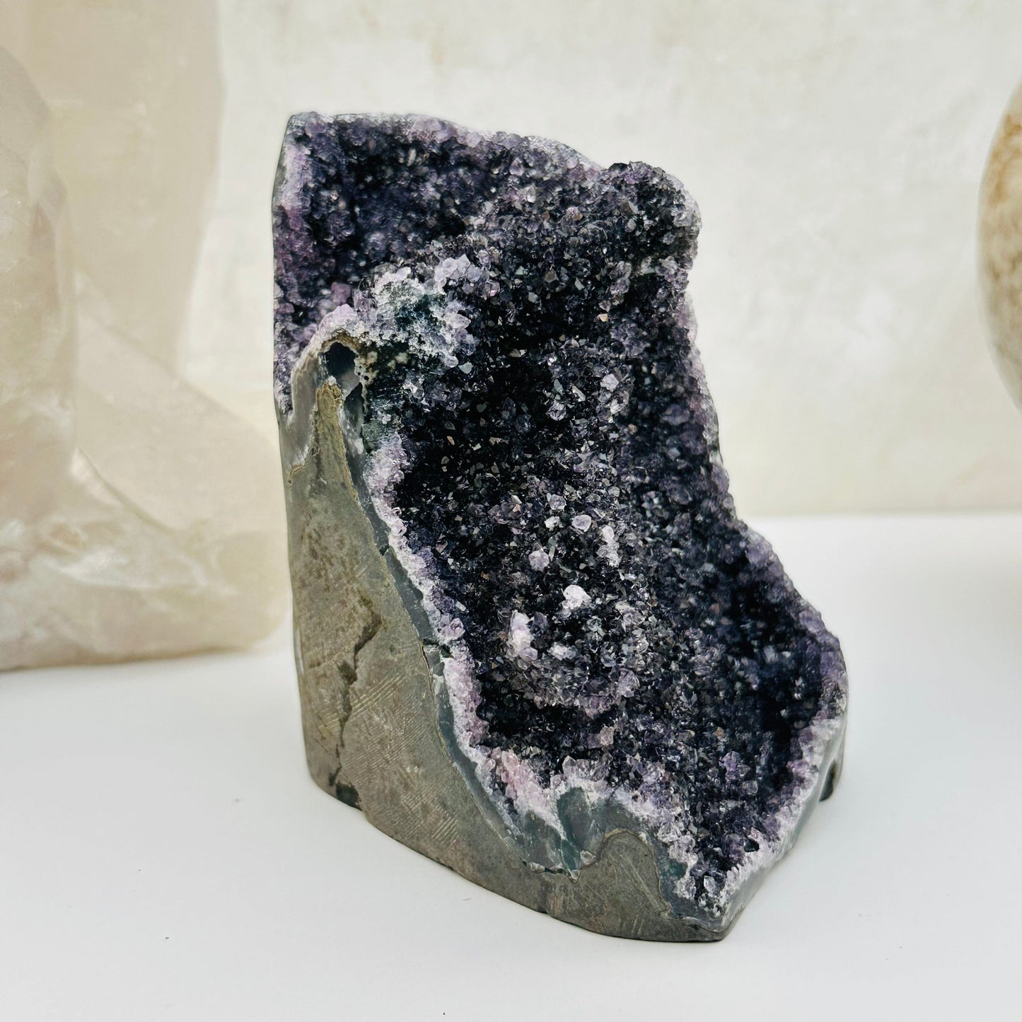 black amethyst druzy cut base crystals displayed as home decor 