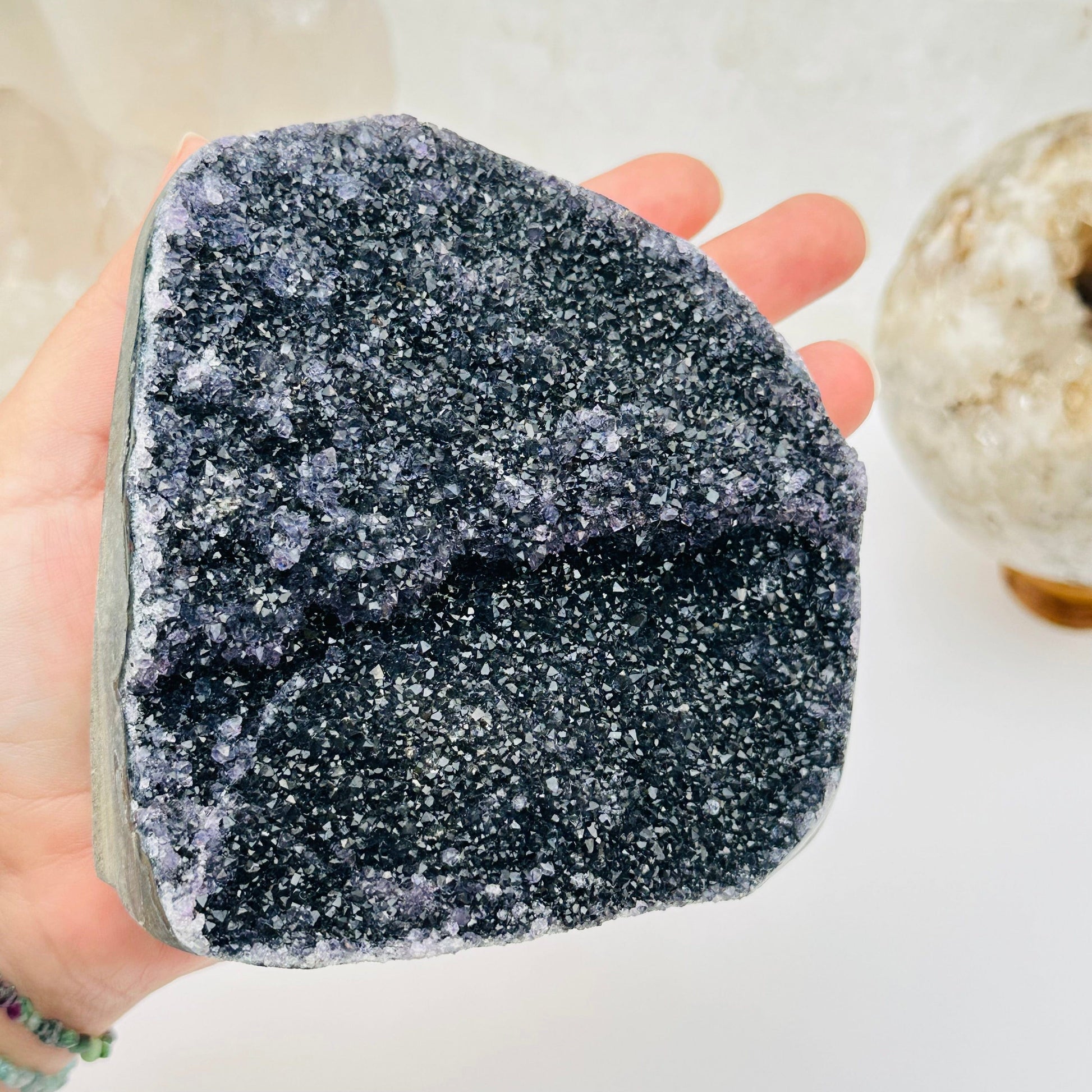 close up of the details on this black amethyst druzy cut base 