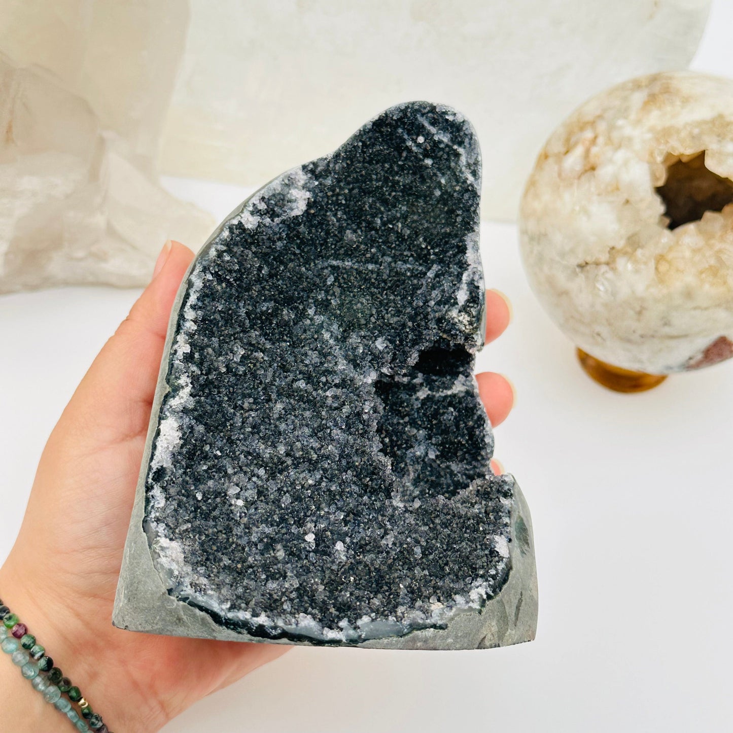 close up of the details on this black amethyst druzy cut base 