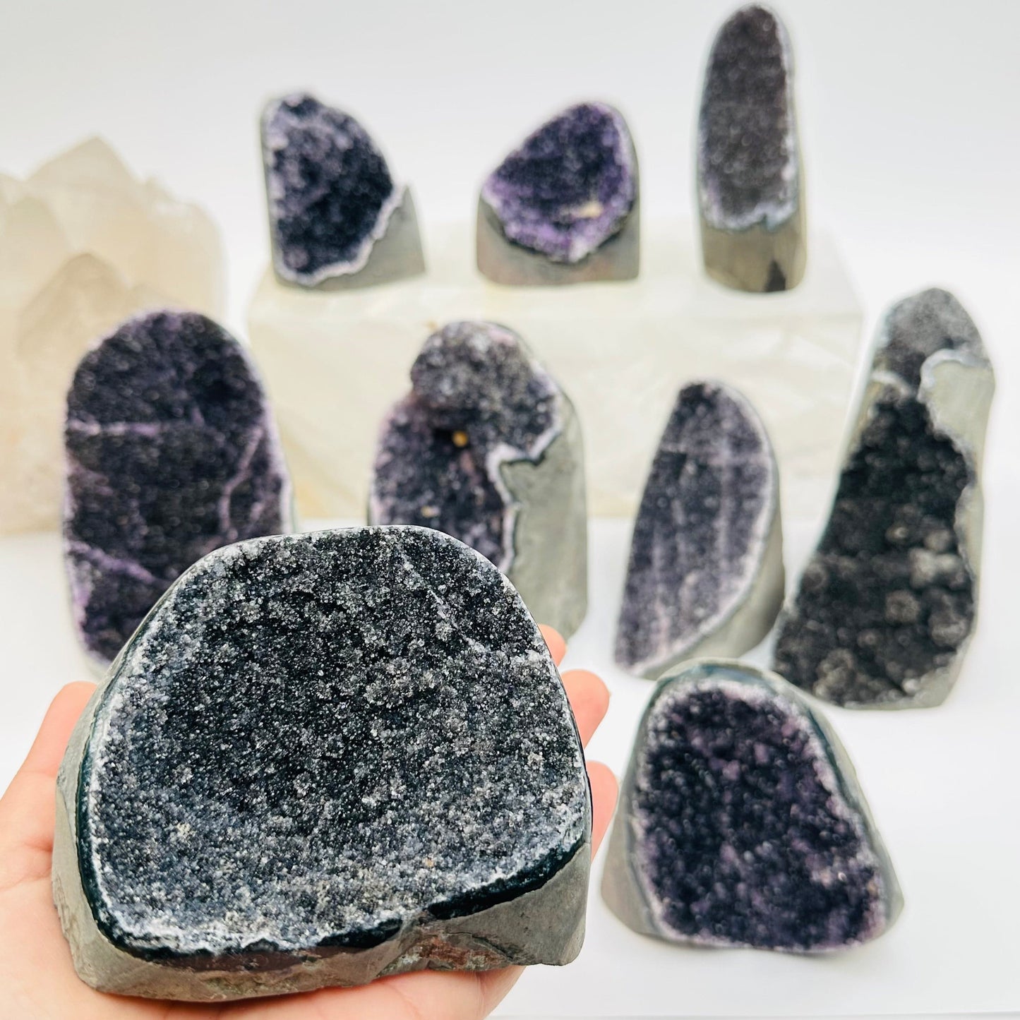 black amethyst druzy in hand for size reference 