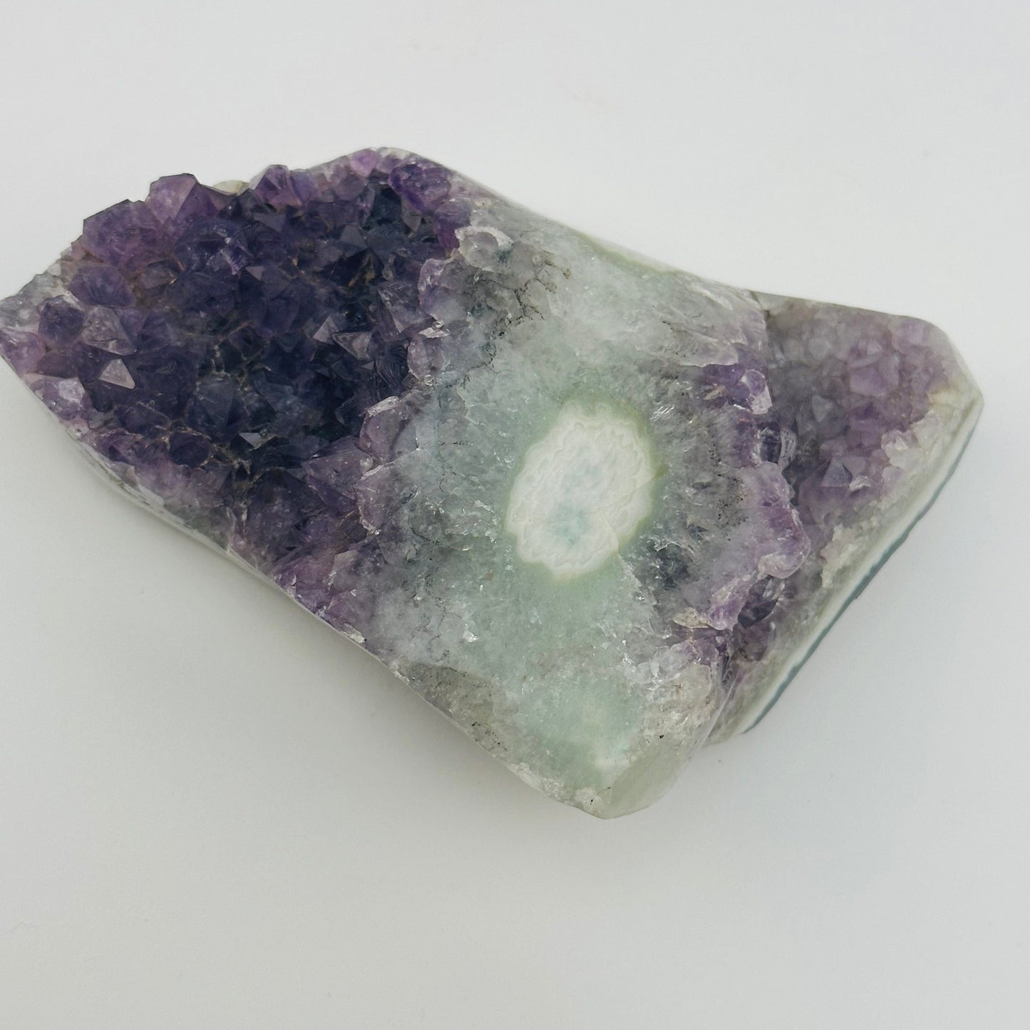 close up of the details on this amethyst crystal cluster with stalactite 