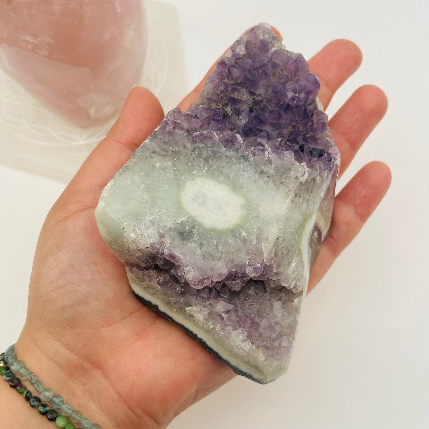 amethyst crystal cluster with stalactite in hand for size reference 