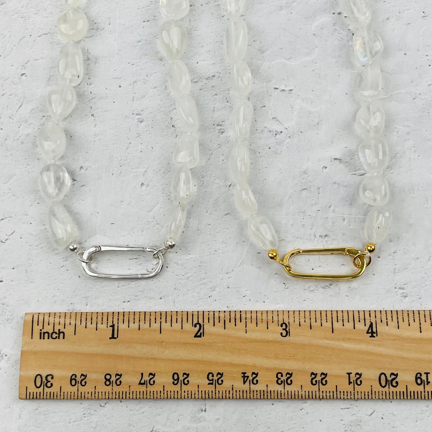 necklace bail next to a ruler for size reference 