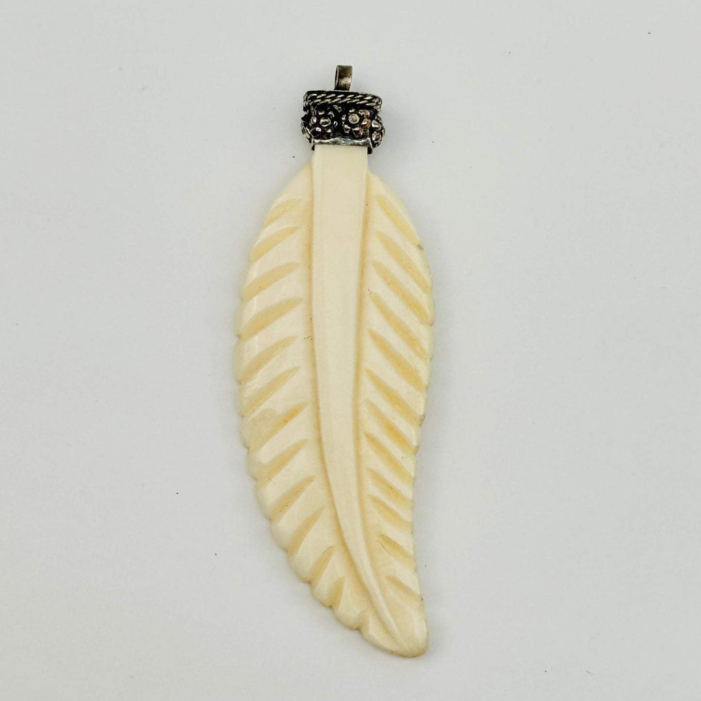 close up of the details on the carved feather 