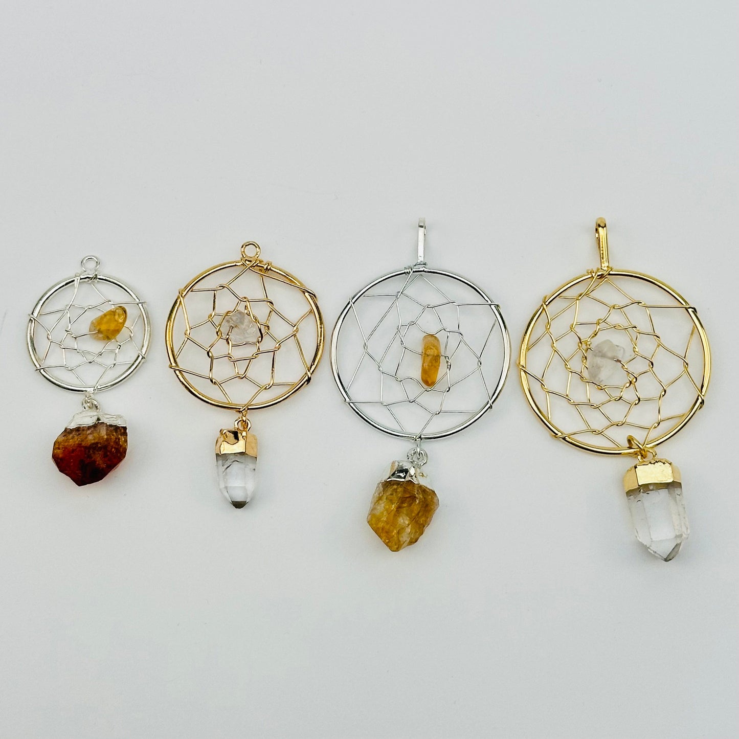 close up of the details on these dream catcher pendants 