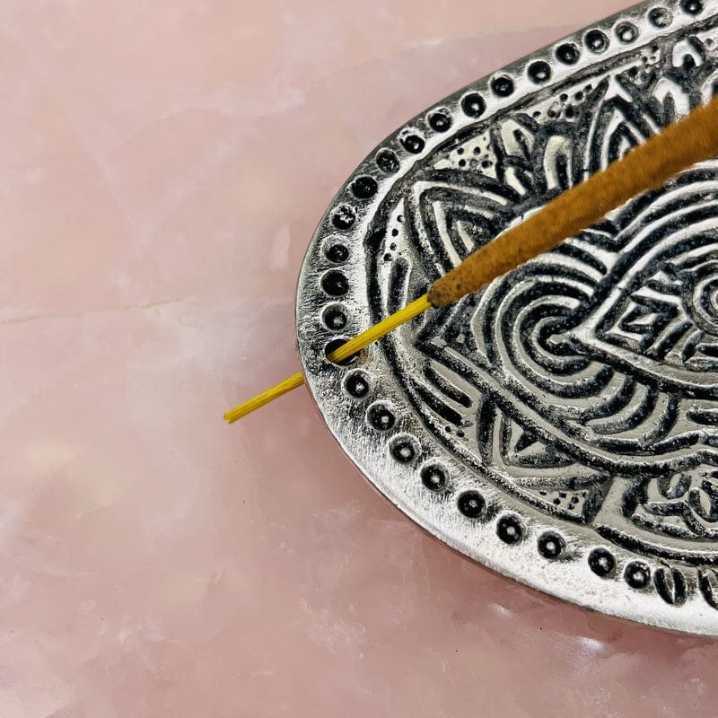 close up of the incense burner showing where the stick is supported 