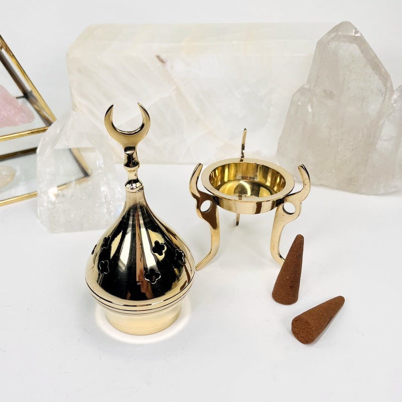 brass cone burner set up as home decor 
