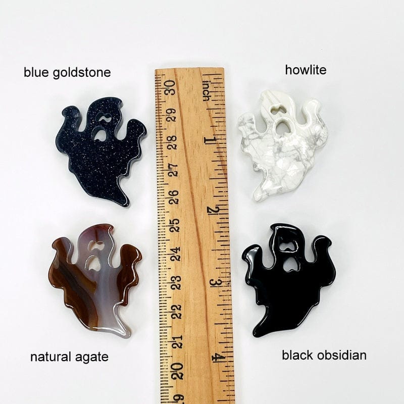 ghost gemstones next to a ruler for size reference 