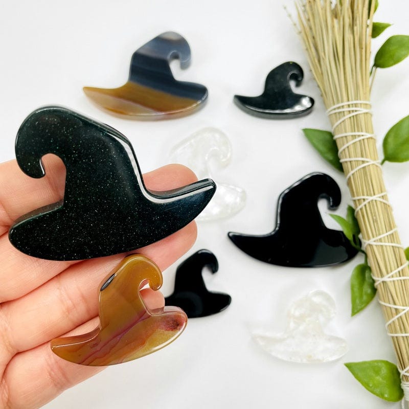 witch hate shaped cabochons in hand for size reference 