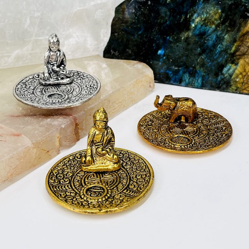 close up of the details on the cone and incense stick burners 