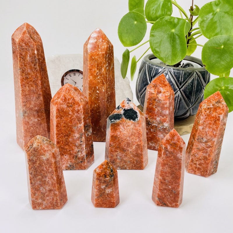 multiple extra quality orchid calcite points displayed to show the differences in the sizes and color shades 