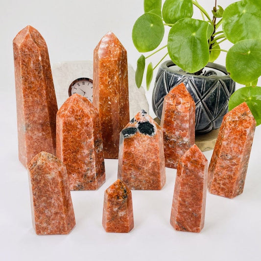 multiple extra quality orchid calcite points displayed to show the differences in the sizes and color shades 