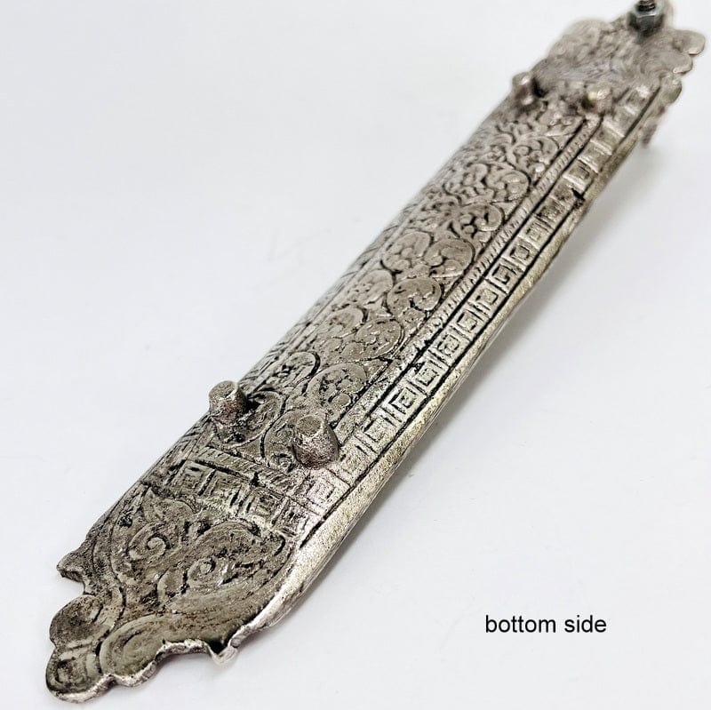 bottom side of the incense burner to show that its propped up