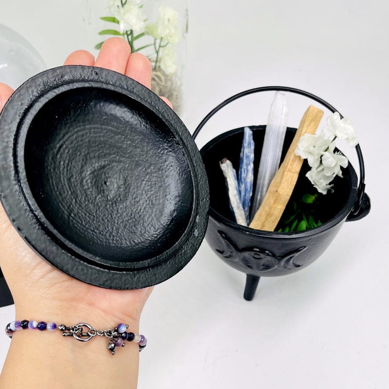 cauldron with lid in hand for size reference 