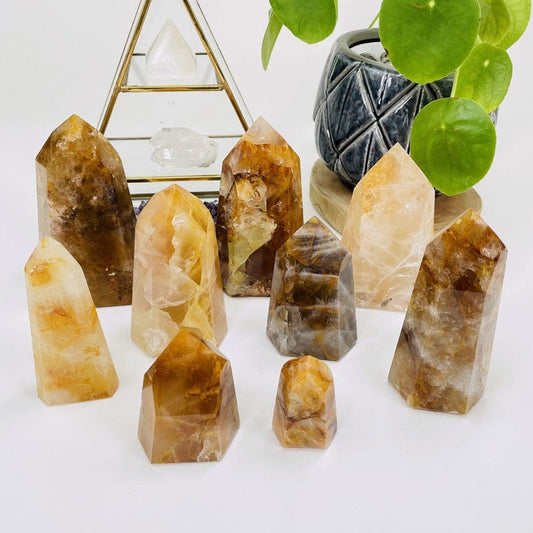 multiple golden healer polished points displayed to show the differences in the color shades and sizes 