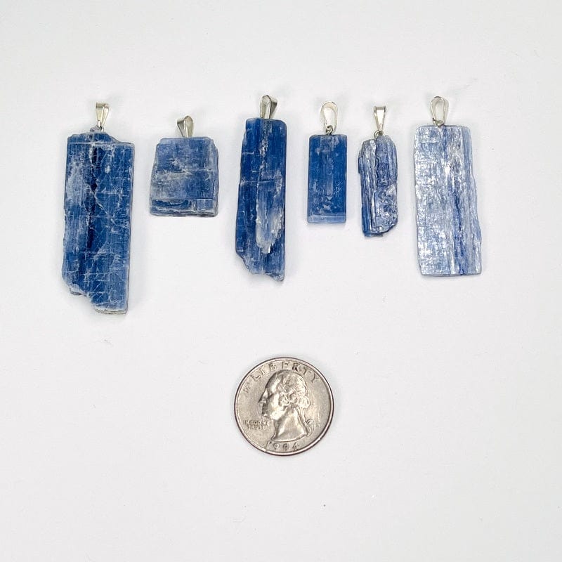 pendants next to a quarter for size reference 