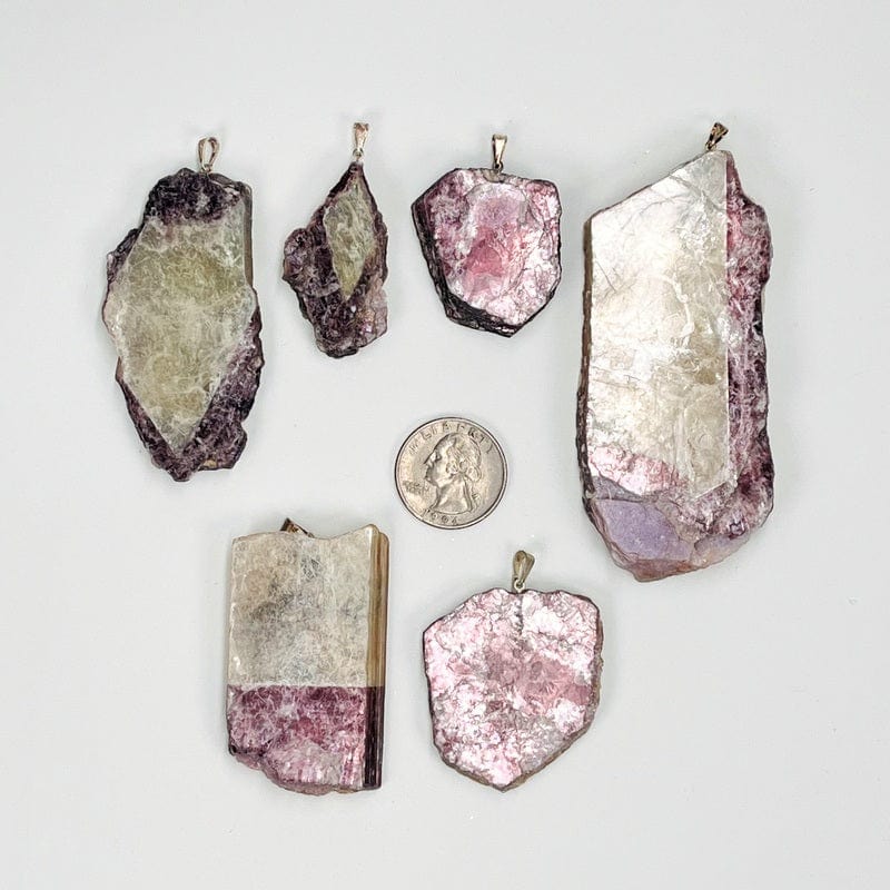 pendants next to a quarter for size reference 