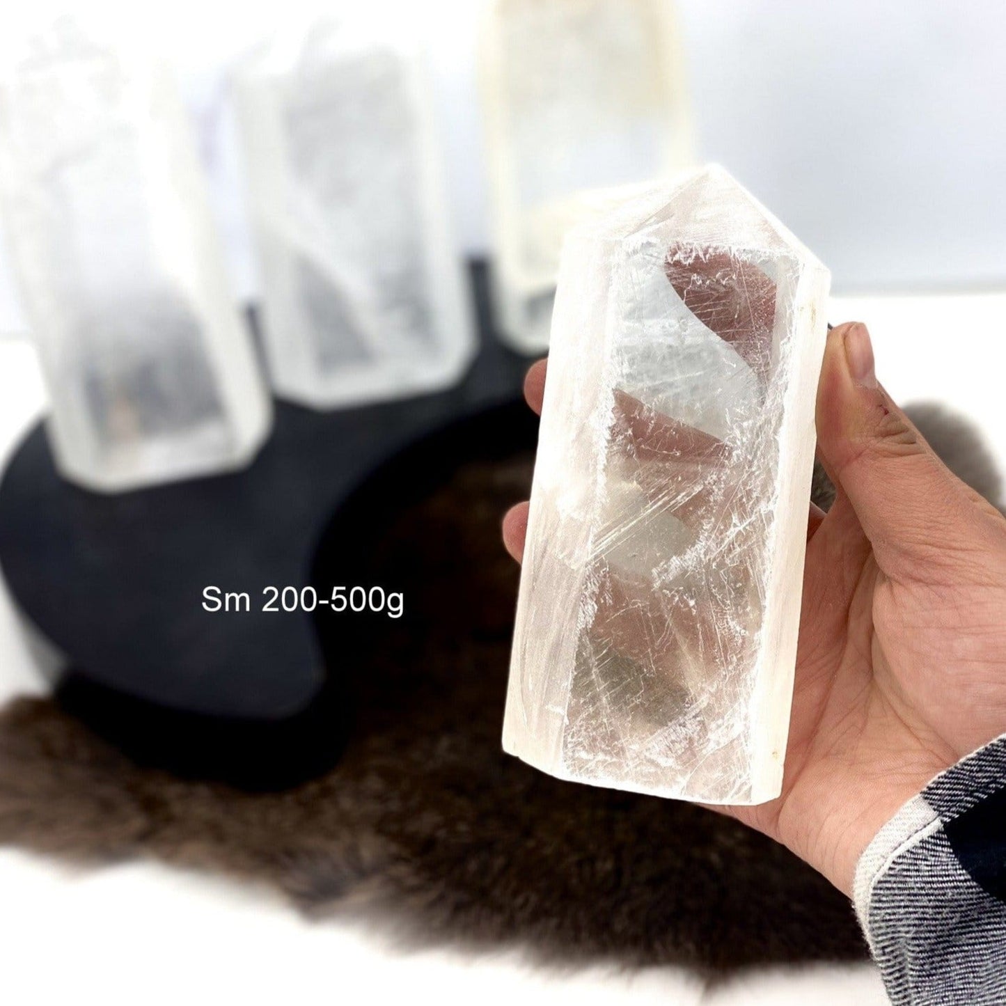 Polished Selenite Semi-Polished Point - small 200-500 g in a hand for size reference
