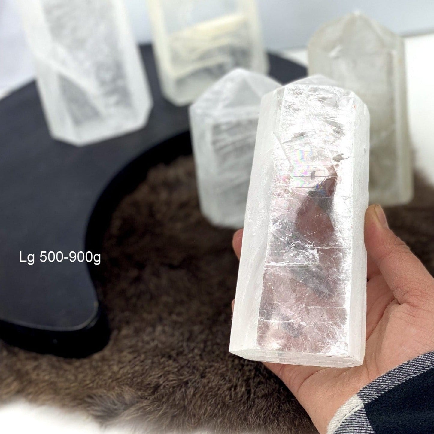 Polished Selenite Semi-Polished Point large, 500-900 g in a hand for size reference
