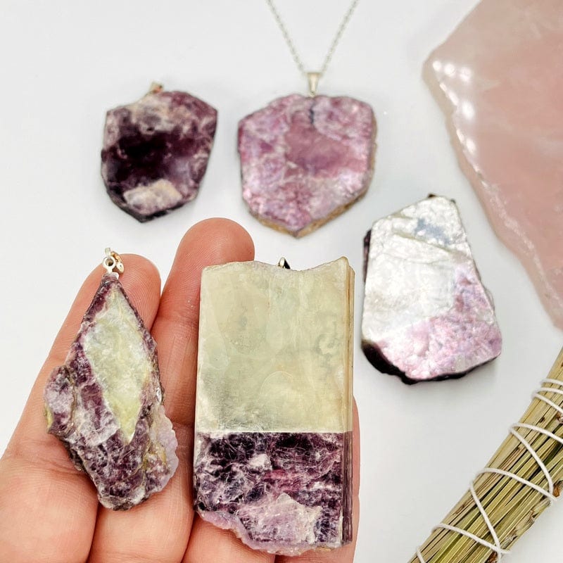mica pendants in hand for size reference 