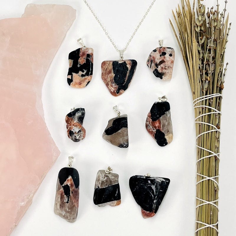 pendants displayed next to each other to show the differences in shapes and color