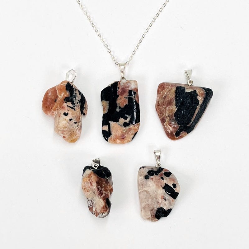 black tourmaline and feldspar pendant displayed on chain