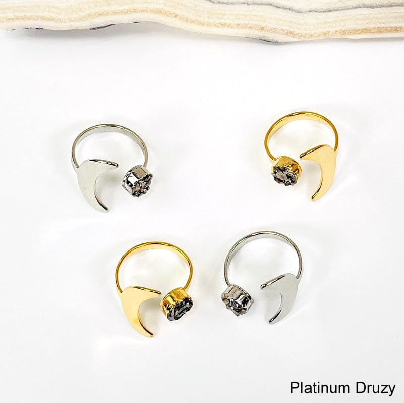 close up of moon rings with platinum druzy gemstone accent