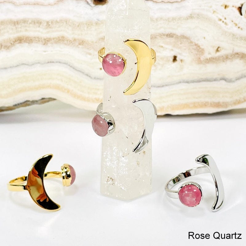 close up of moon rings with rose quartz gemstone accent