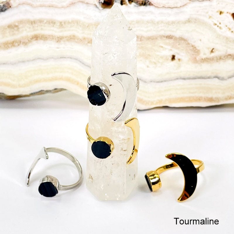 close up of moon rings with tourmaline gemstone accent 