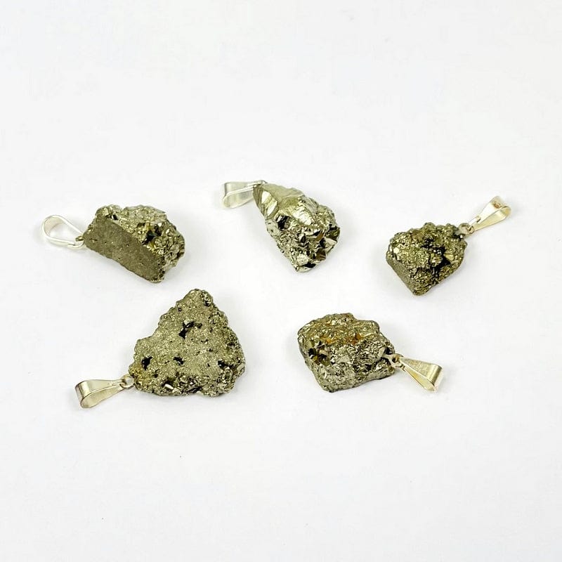 different angles of pyrite pendant with silver bail