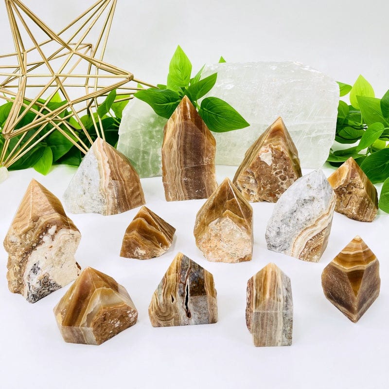 multiple high grade aragonite semi polished points showing different colors and patterns available 