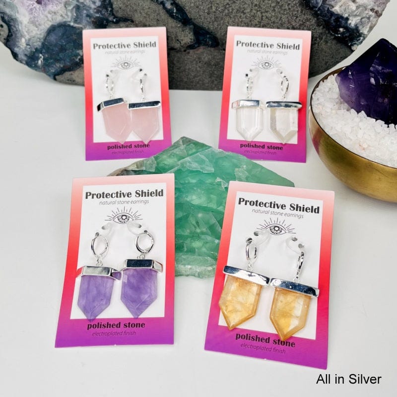 all of the crystal earrings electroplated in silver displayed to show the differences in the stones