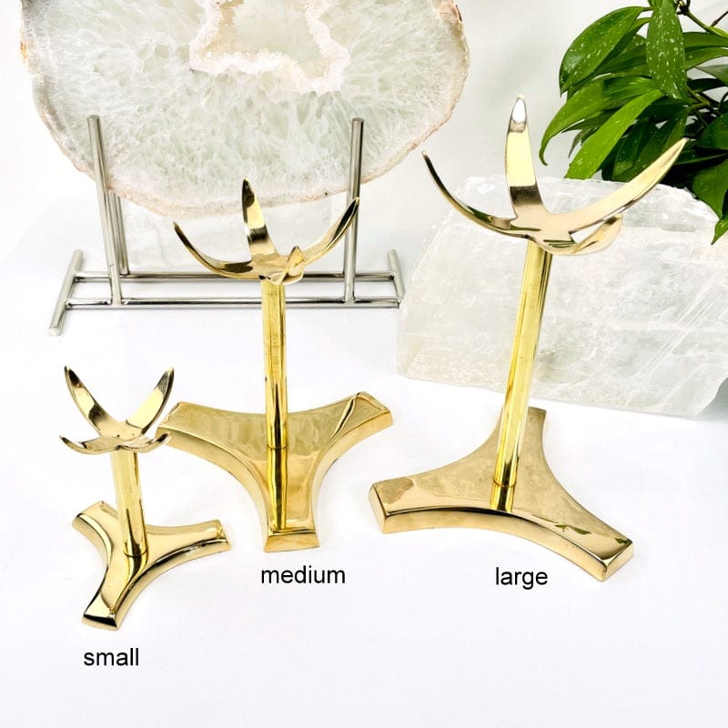 Small, medium, and large gold colored sphere stands labeled on a white background.