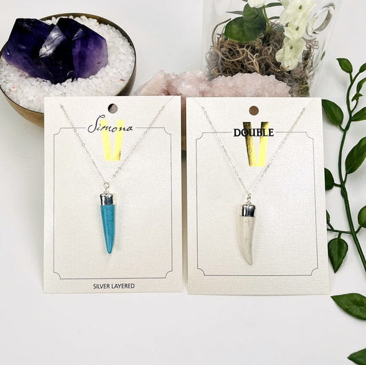 howlite horn necklace available in white or turquoise 