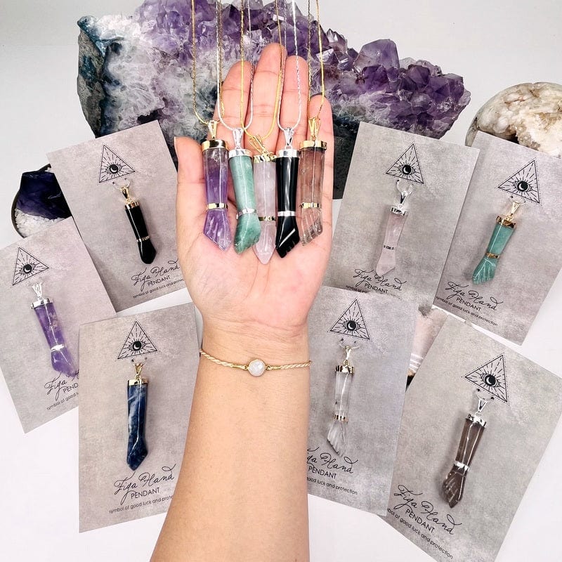 figa hand pendants displayed to show the differences on the stone types available