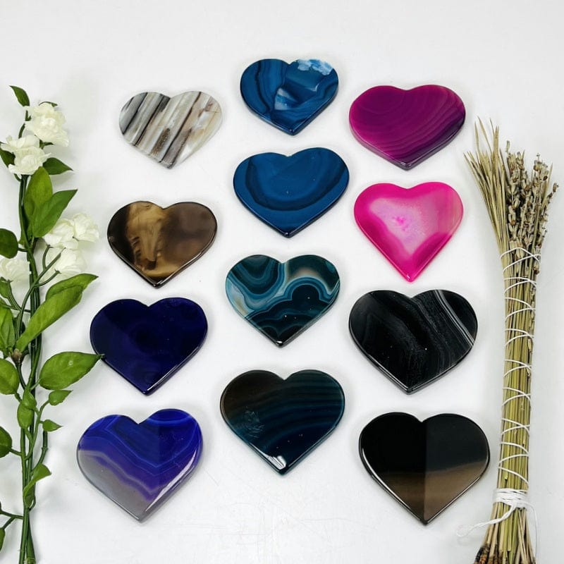 multiple colored agate heart slices in rows 