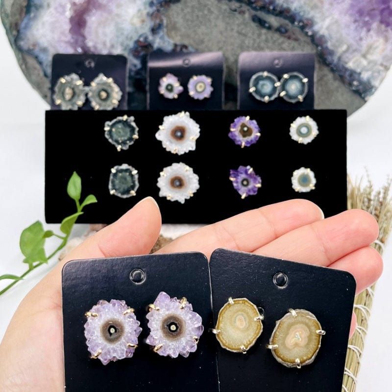 amethyst stalactite earrings in hand for size reference 
