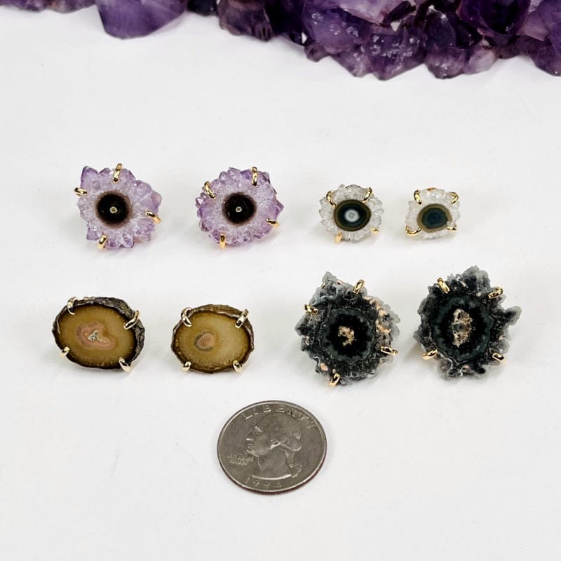 earrings next to a quarter for size reference 