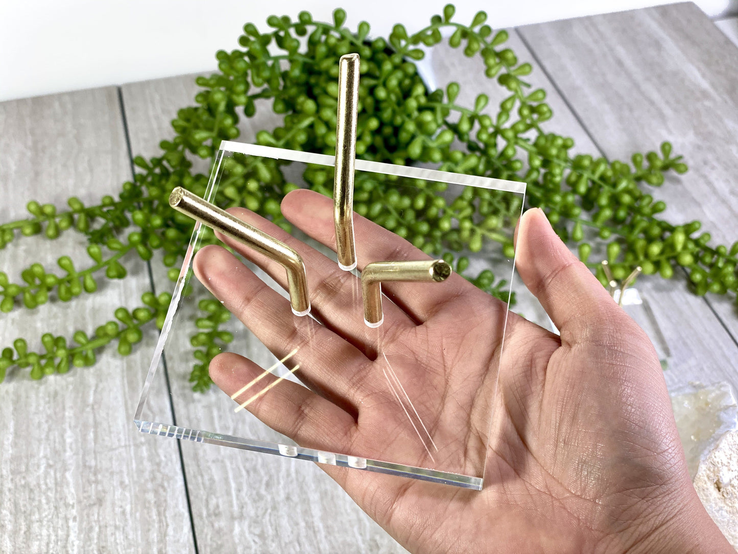 Large Crystal Sphere Display Stand Acrylic Crystal Holder on hand for size comparison