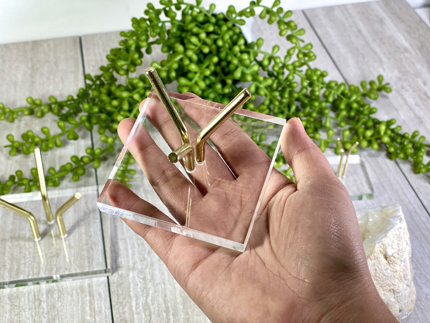 Medium Crystal Sphere Display Stand Acrylic Crystal Holder on hand for size comparison
