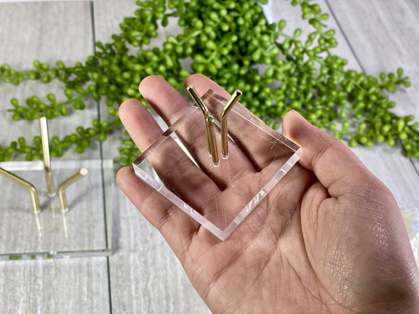Small Crystal Sphere Display Stand Acrylic Crystal Holder on hand for size comparison