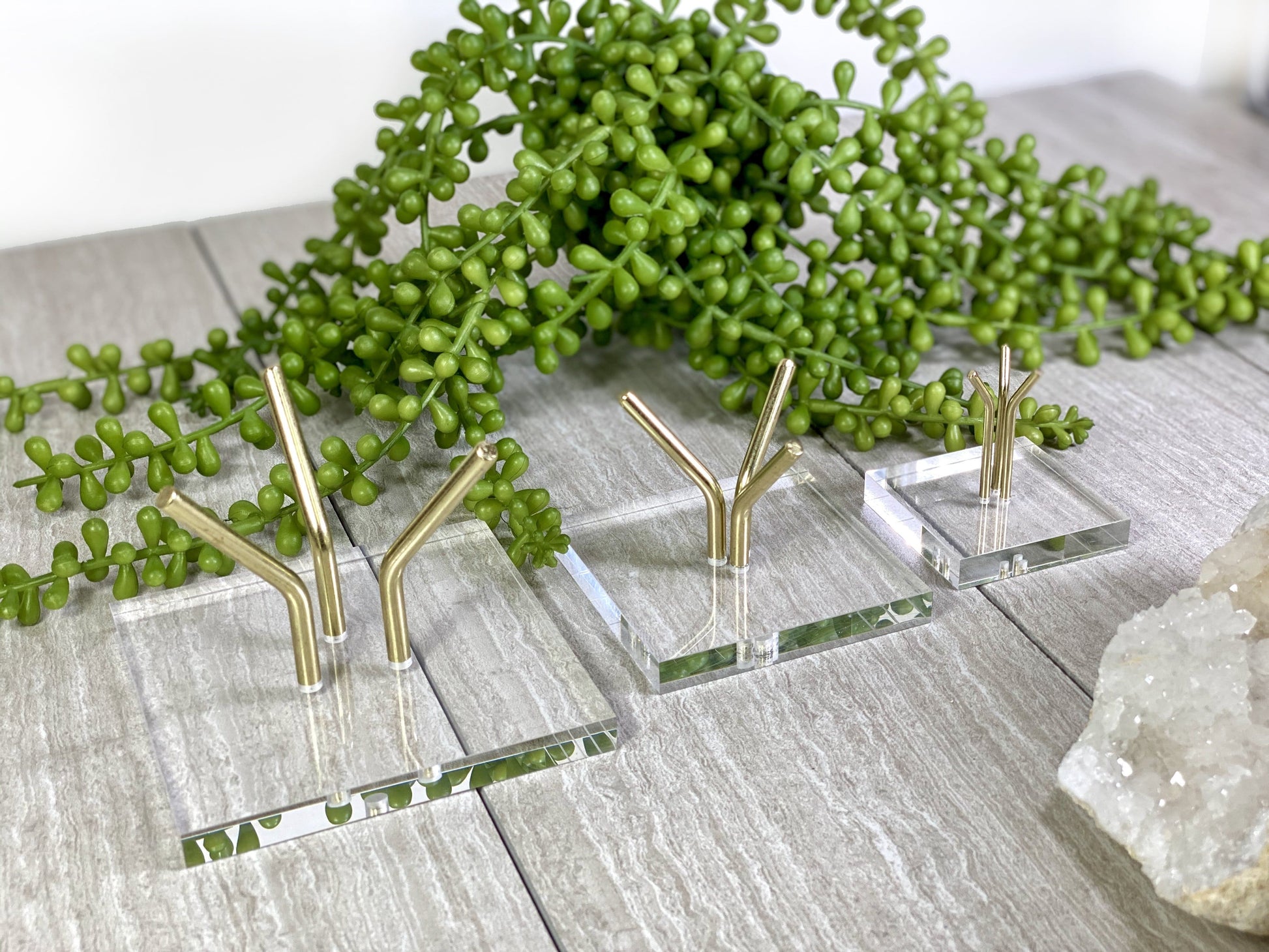 Size angle view of Crystal Sphere Display Stand Acrylic Crystal Holder in sizes large, medium, and small