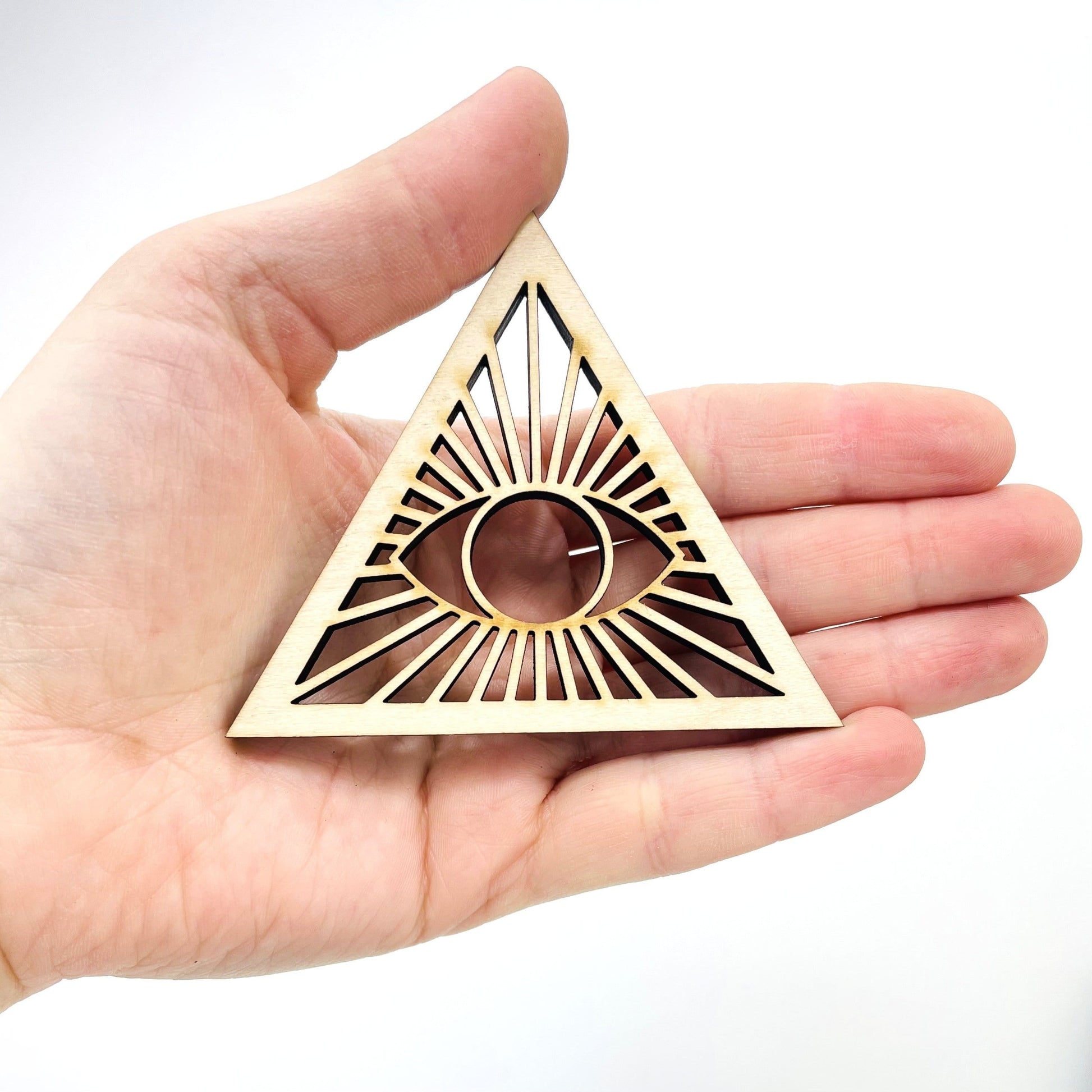 A Eye of Providence Wooden Sphere Stand on hand.