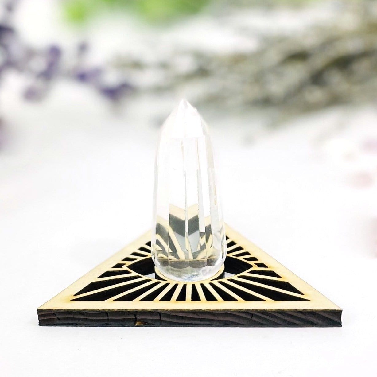 A Eye of Providence Wooden Sphere Stand with a crystal point in the top. 