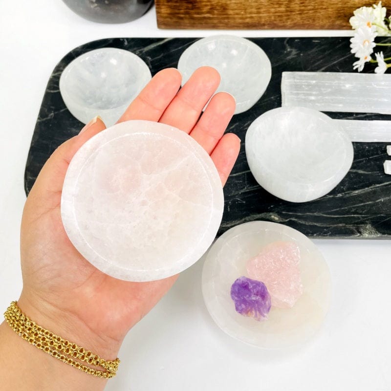 selenite bowl in hand displaying size 