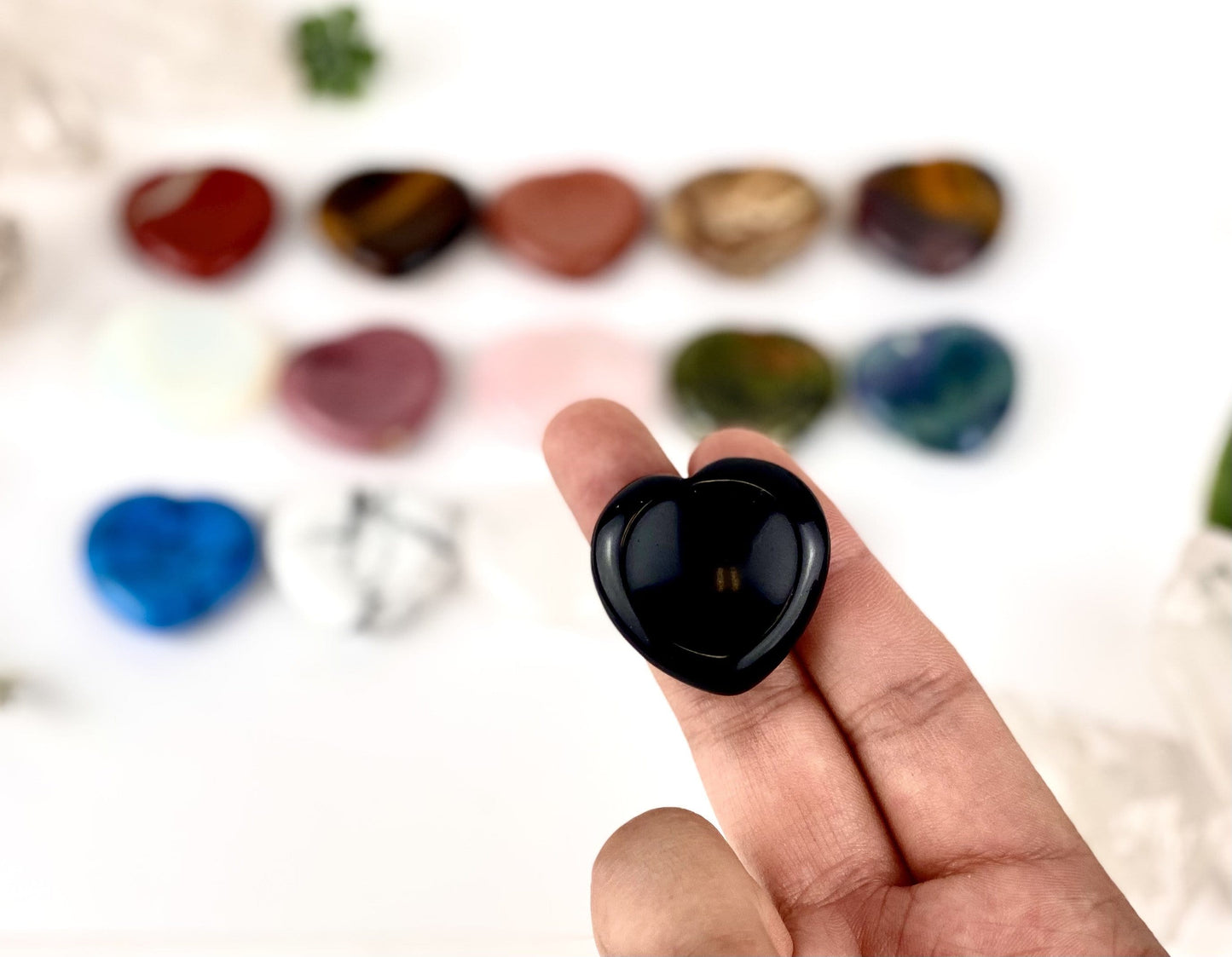 Gemstone Heart Worry Stone displayed in hand for size reference